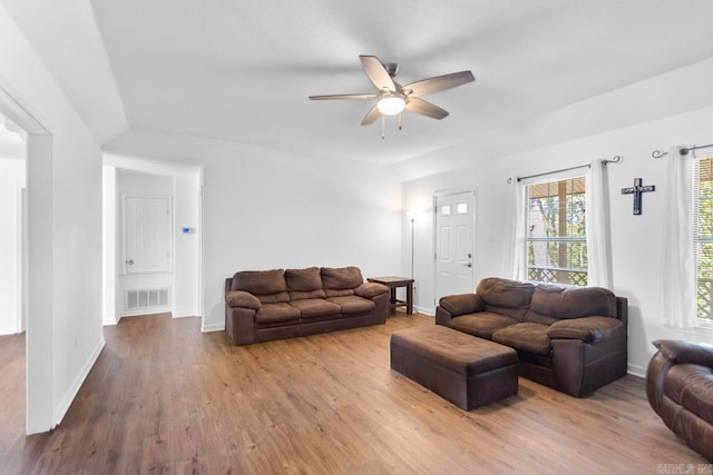 living room with ceiling fan and hardwood / wood-style floors