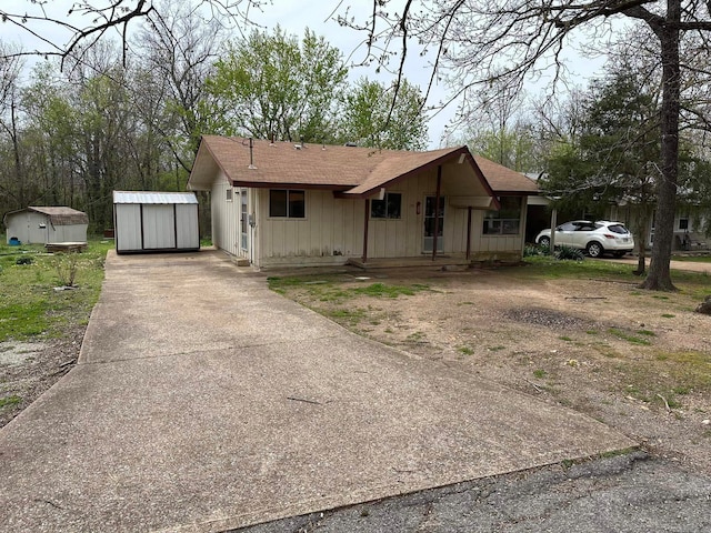 view of front of home with a storage shed