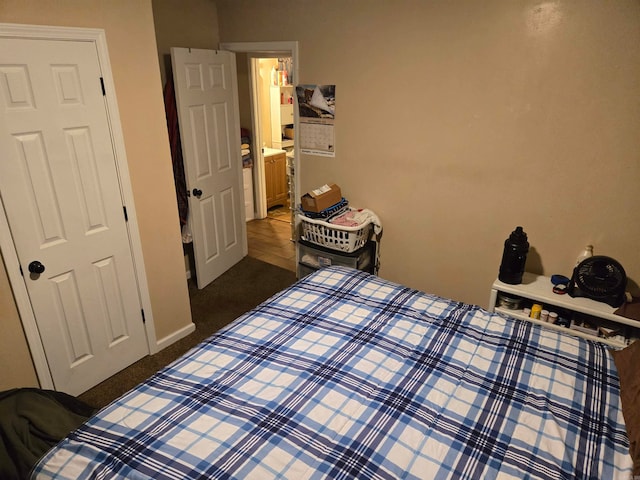 bedroom with dark carpet