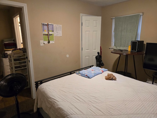 bedroom with wood-type flooring