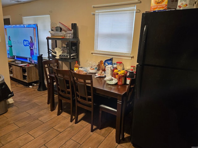 dining room with light hardwood / wood-style floors