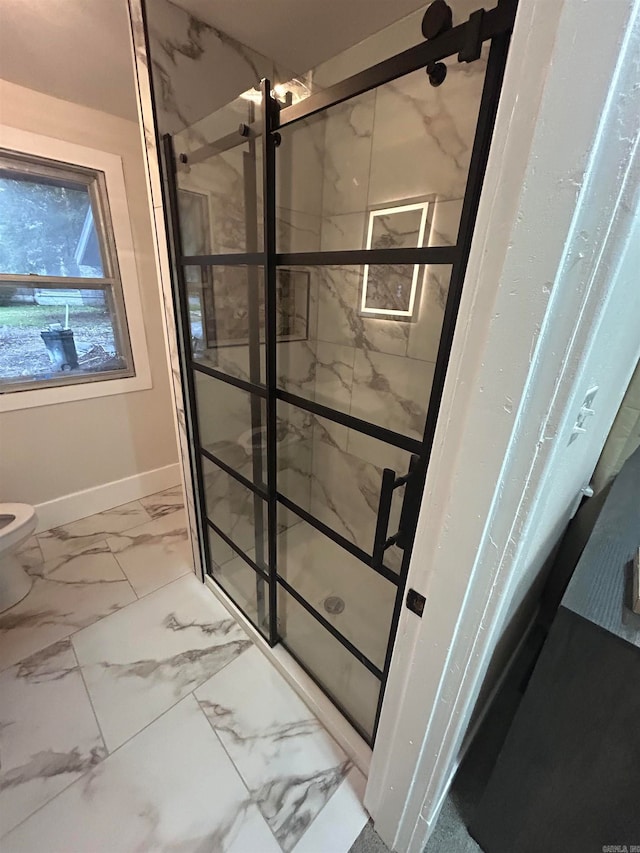 bathroom with a tile shower