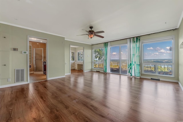 unfurnished living room with ornamental molding, ceiling fan, and hardwood / wood-style floors