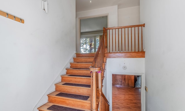 stairs with wood-type flooring