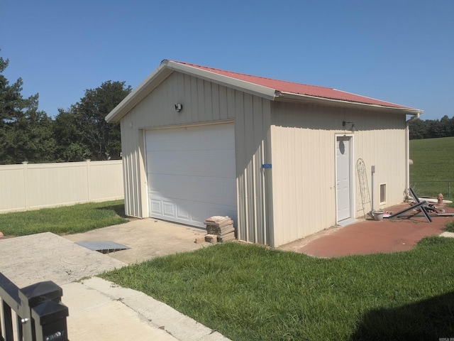 garage featuring a yard