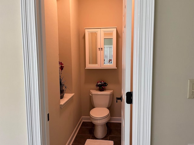 bathroom featuring toilet and tile patterned floors