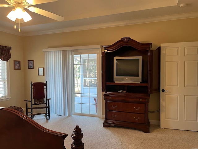 carpeted bedroom featuring access to outside, ornamental molding, and ceiling fan