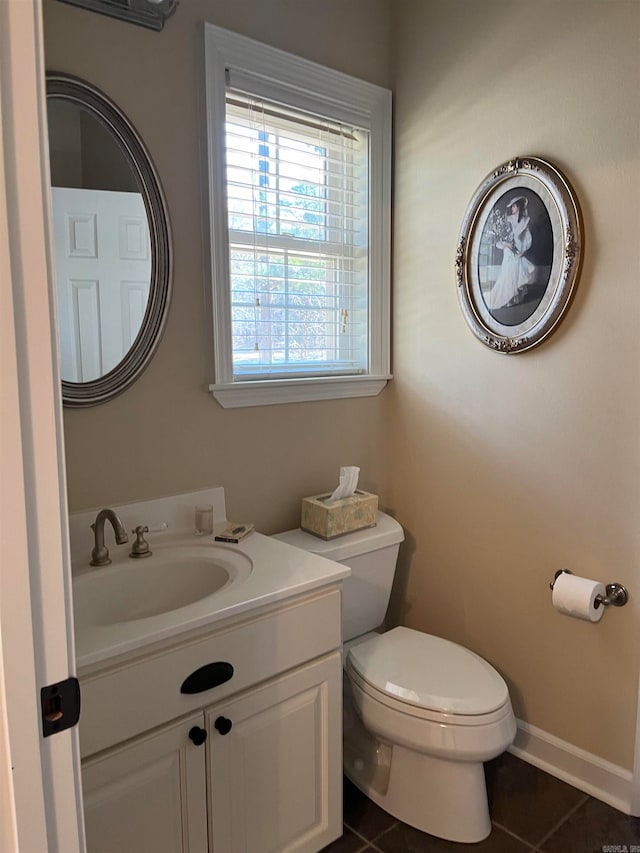 bathroom featuring vanity, toilet, and tile patterned floors