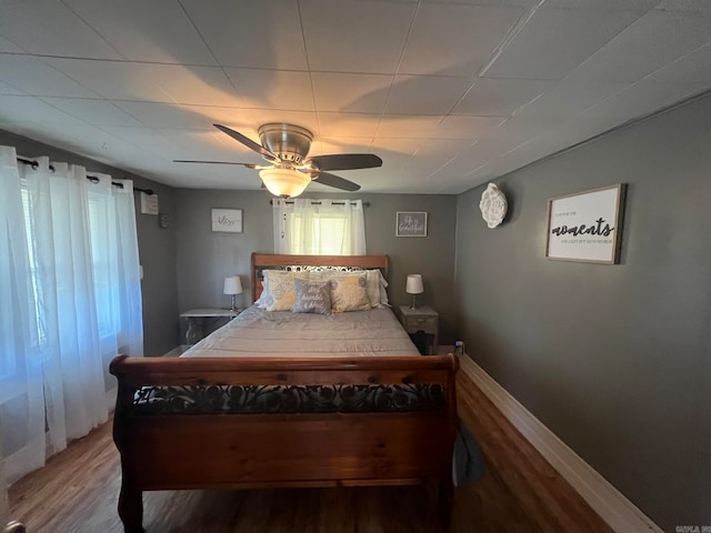 bedroom featuring wood-type flooring and ceiling fan