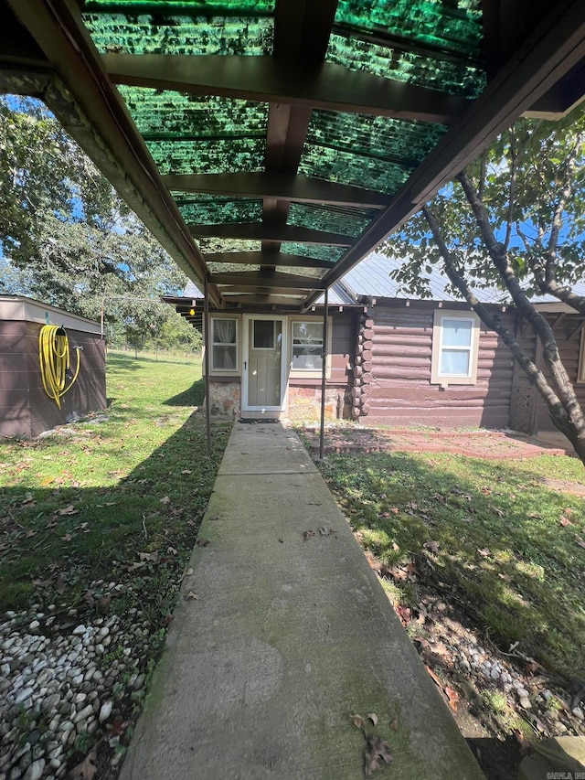 exterior space featuring a pergola and a yard