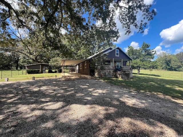 view of front facade featuring a front lawn and a carport