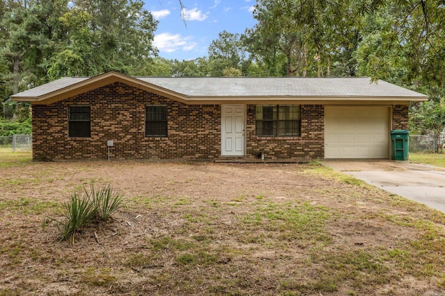 ranch-style home featuring a garage