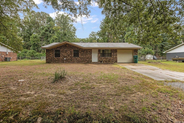 ranch-style house featuring a garage and a front lawn