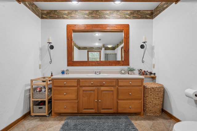 bathroom with tile patterned flooring and vanity