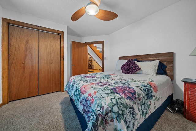 carpeted bedroom with a closet and ceiling fan