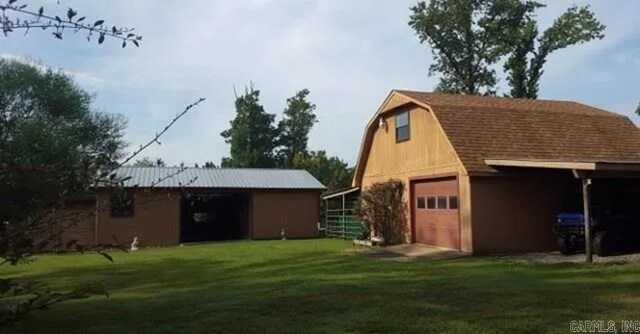 view of outdoor structure with a lawn