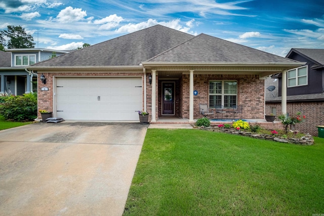 view of front of home featuring a porch, a garage, and a front lawn