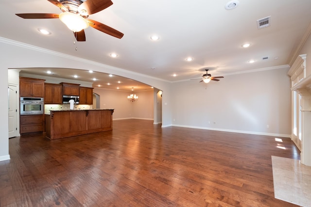 unfurnished living room with crown molding, ceiling fan with notable chandelier, and dark hardwood / wood-style floors