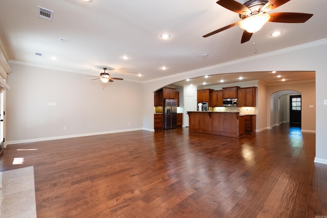 unfurnished living room with ornamental molding and dark wood-type flooring