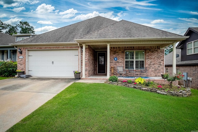 view of front facade with a porch, a garage, and a front lawn