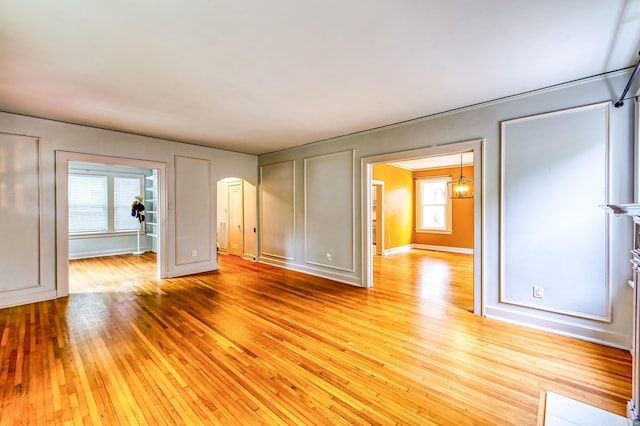 unfurnished living room with light wood-type flooring