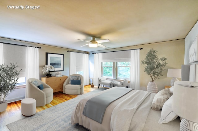 bedroom featuring light hardwood / wood-style floors and ceiling fan