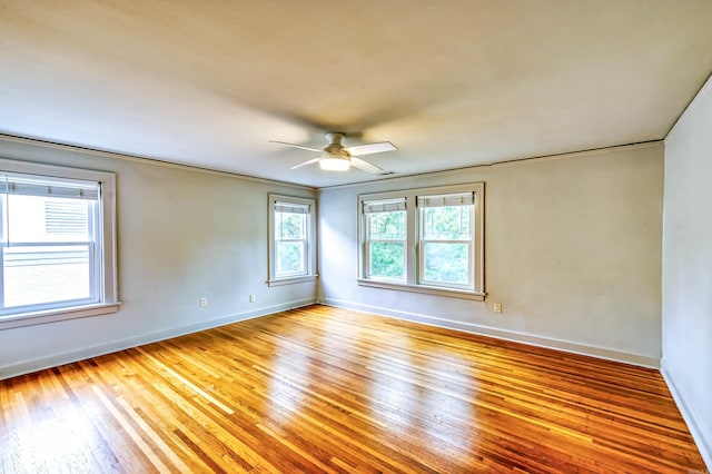 empty room featuring light wood-type flooring and ceiling fan