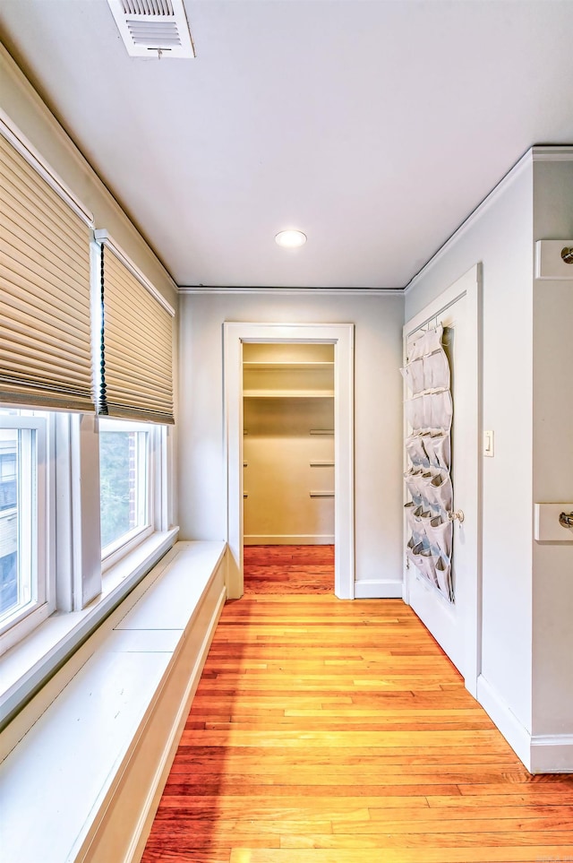 hall with light hardwood / wood-style flooring