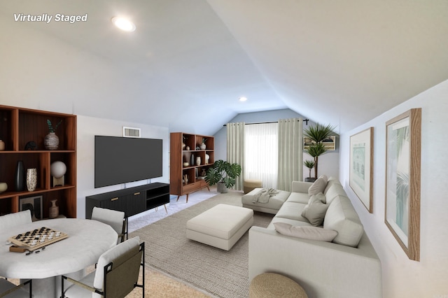 living room featuring vaulted ceiling