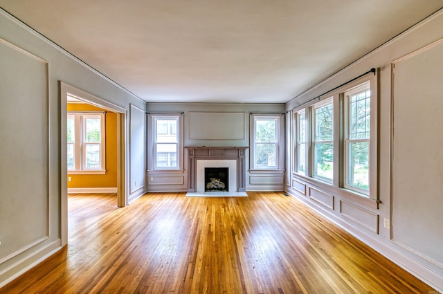 unfurnished living room featuring light wood-type flooring