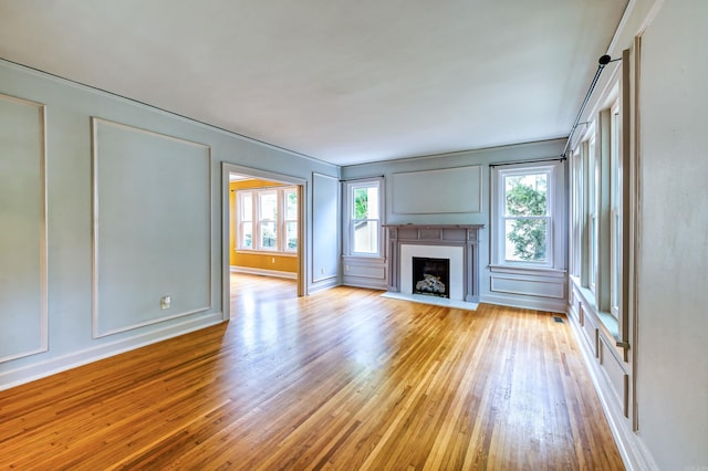 unfurnished living room featuring light hardwood / wood-style floors