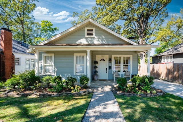 bungalow-style house featuring a front yard and a porch