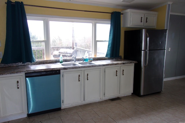 kitchen with appliances with stainless steel finishes, crown molding, sink, and white cabinetry