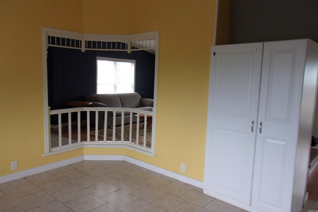 empty room with light tile patterned floors