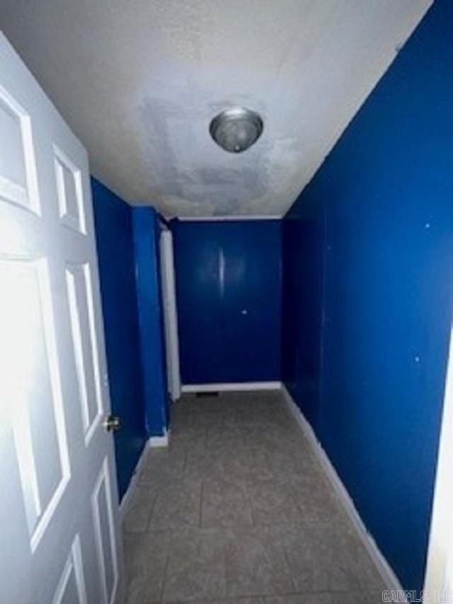 3058 Rocky Ridge Rd, Mountain Home, AR 72653 - corridor with baseboards and vaulted ceiling