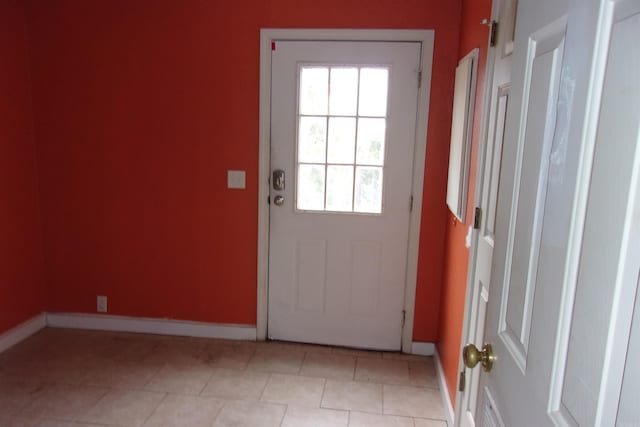 entryway featuring light tile patterned flooring