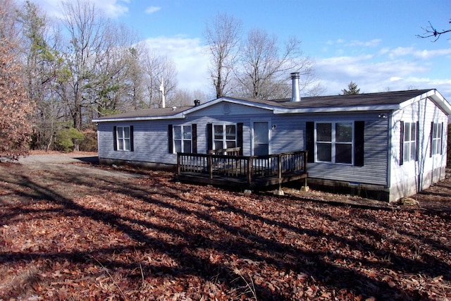 view of front facade with a wooden deck