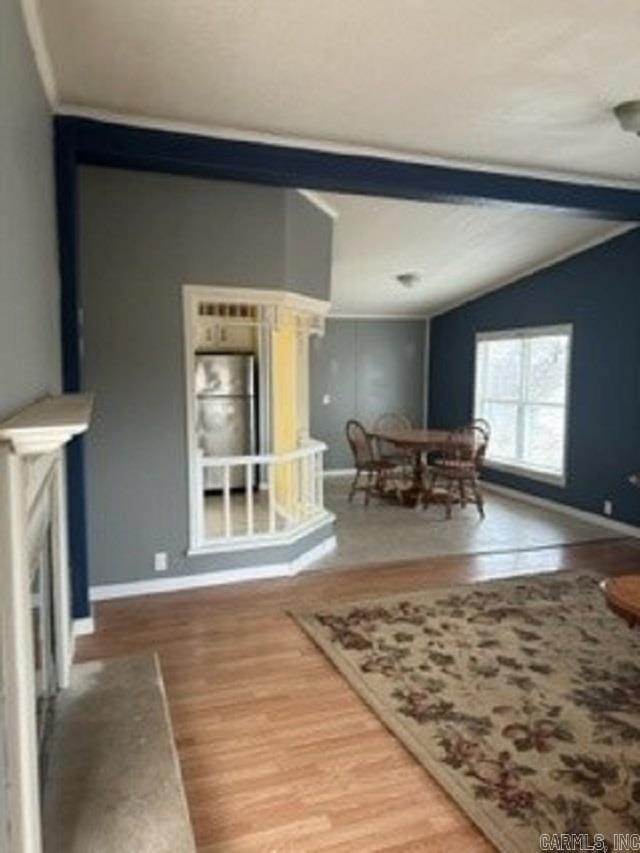 living room with lofted ceiling and hardwood / wood-style floors