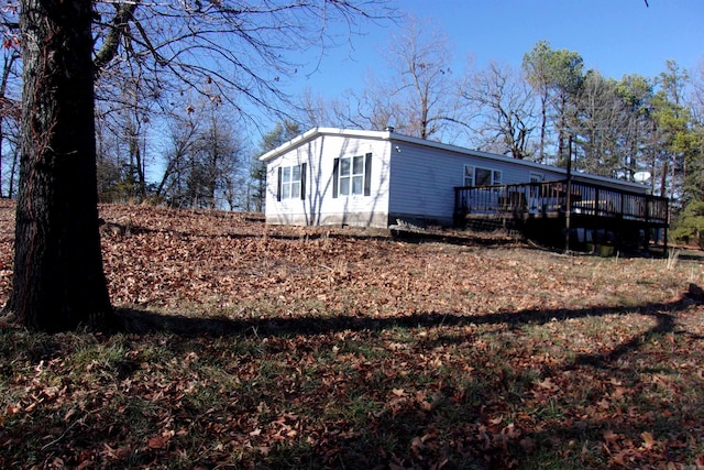 view of property exterior featuring a deck