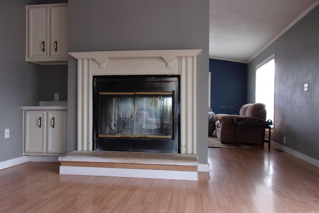 room details with crown molding and hardwood / wood-style floors