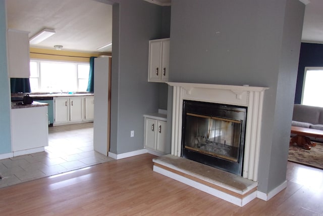 unfurnished living room with light hardwood / wood-style flooring