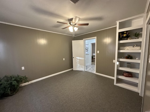 unfurnished bedroom featuring carpet floors, crown molding, a ceiling fan, and baseboards