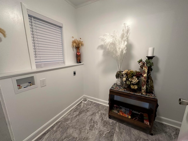 clothes washing area featuring hookup for a washing machine, crown molding, and hookup for an electric dryer