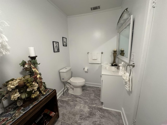 half bathroom with visible vents, baseboards, toilet, ornamental molding, and vanity