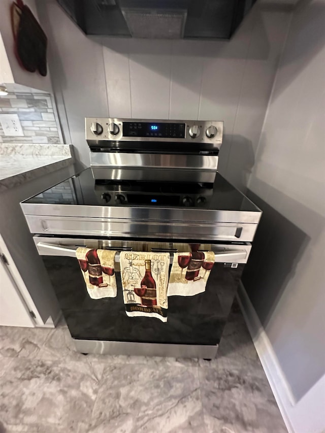 interior details featuring stainless steel range with electric stovetop