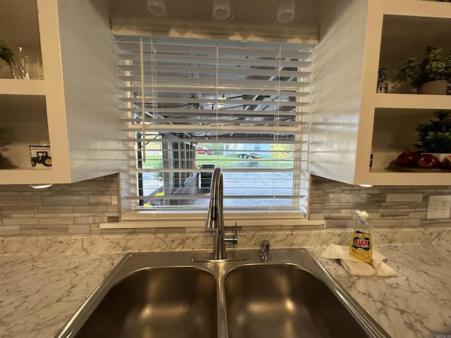 room details with backsplash and a sink
