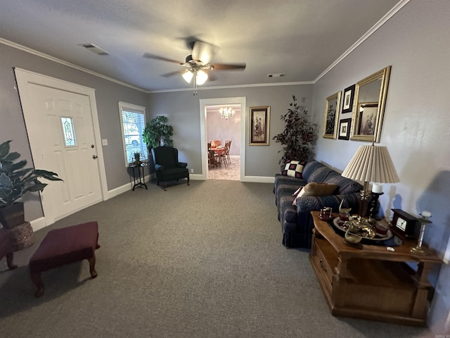 carpeted living area featuring visible vents, ceiling fan, ornamental molding, and baseboards