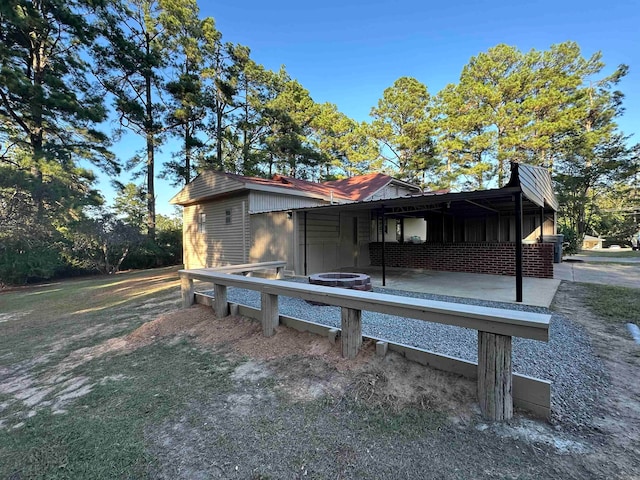 view of side of home featuring a patio area