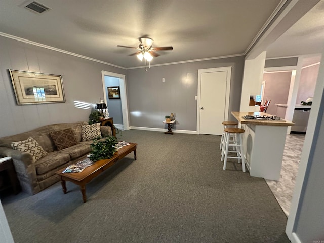 living room featuring ornamental molding, ceiling fan, and dark carpet