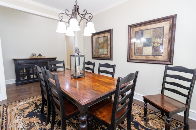 dining space with a chandelier, ornamental molding, and dark hardwood / wood-style flooring